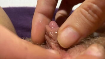 Solo masturbation with extreme close up shots of a puffy and hairy coochie