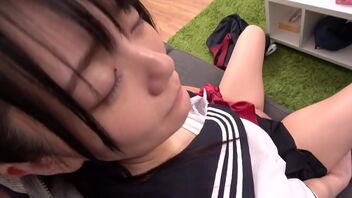 A young Asian girl in a sailor suit looks like an virginal college girl yet she is a slut and shows her abilities with a small dick.