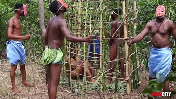 In a far away West African country, during the annual festival, the king has sex with the most beautiful woman locked in a cage while his princess and the guards watch.