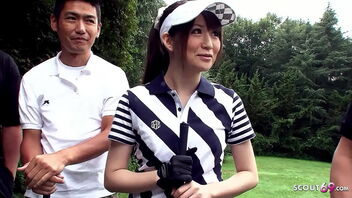 Young Asian girl tempted by her teacher and other men to perform a blowbang during a golf lesson