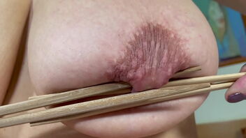 A European MILF enjoys unusual pleasure with ice and sushi sticks.