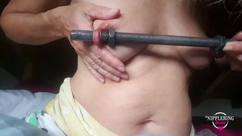 A insane nymph loves 16mm rods in her extreme nipple piercings.