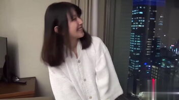 Asian girl's solo play in a Japanese style game room