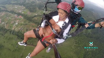 Mariana Martix, the ebony actress from Colombia goes paragliding bare and pleasuring herself.