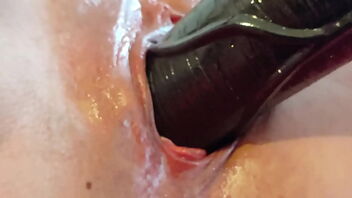 Close up of a big cock dildo in activity