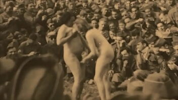 Natural beauty of a girl in a vintage strip-tease for the soldiers in the war zone.